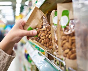 Hand reaching for almond packets