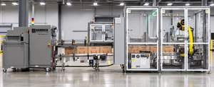 Integrated packaging line with an Endoline 227 Case Erector and Hamrick Packaging Systems end-of-line technology